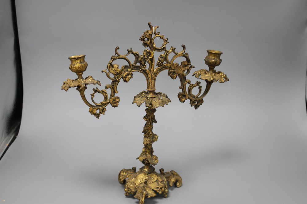 A 19th century French ormolu twin branch candelabrum, modelled with vines and scrolls, height 34cm